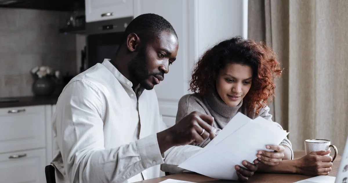 Couple reviewing a $5,000 personal loan application in Canada